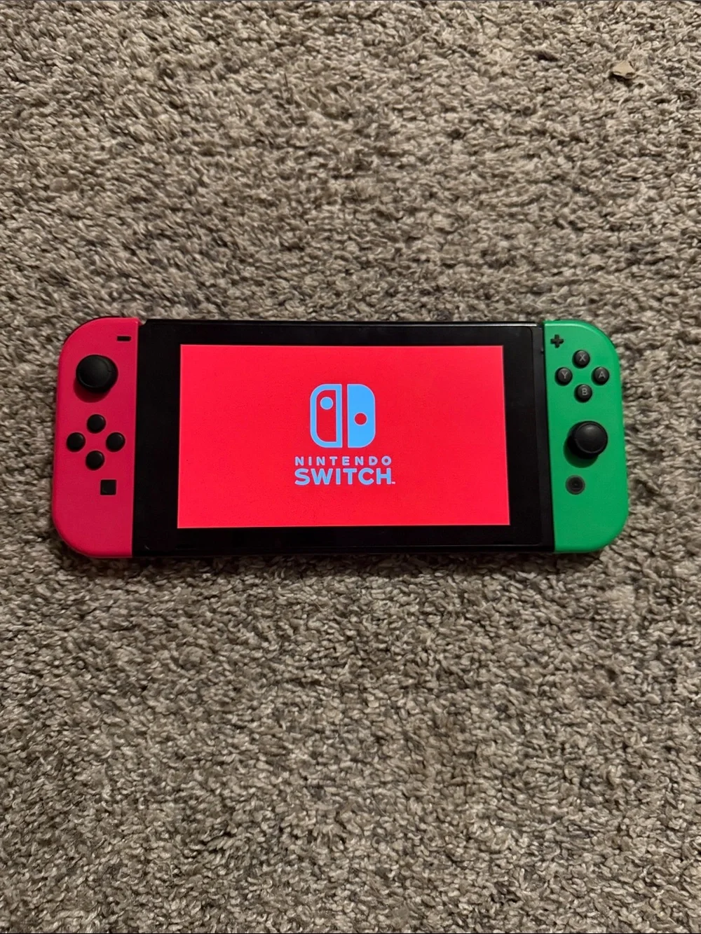 Nintendo Switch with Pink Left and Green Right Joy‑Con